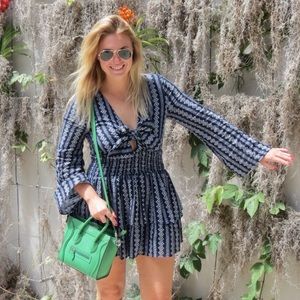 Moon River navy and white flare long sleeve smocked ruffle mini dress